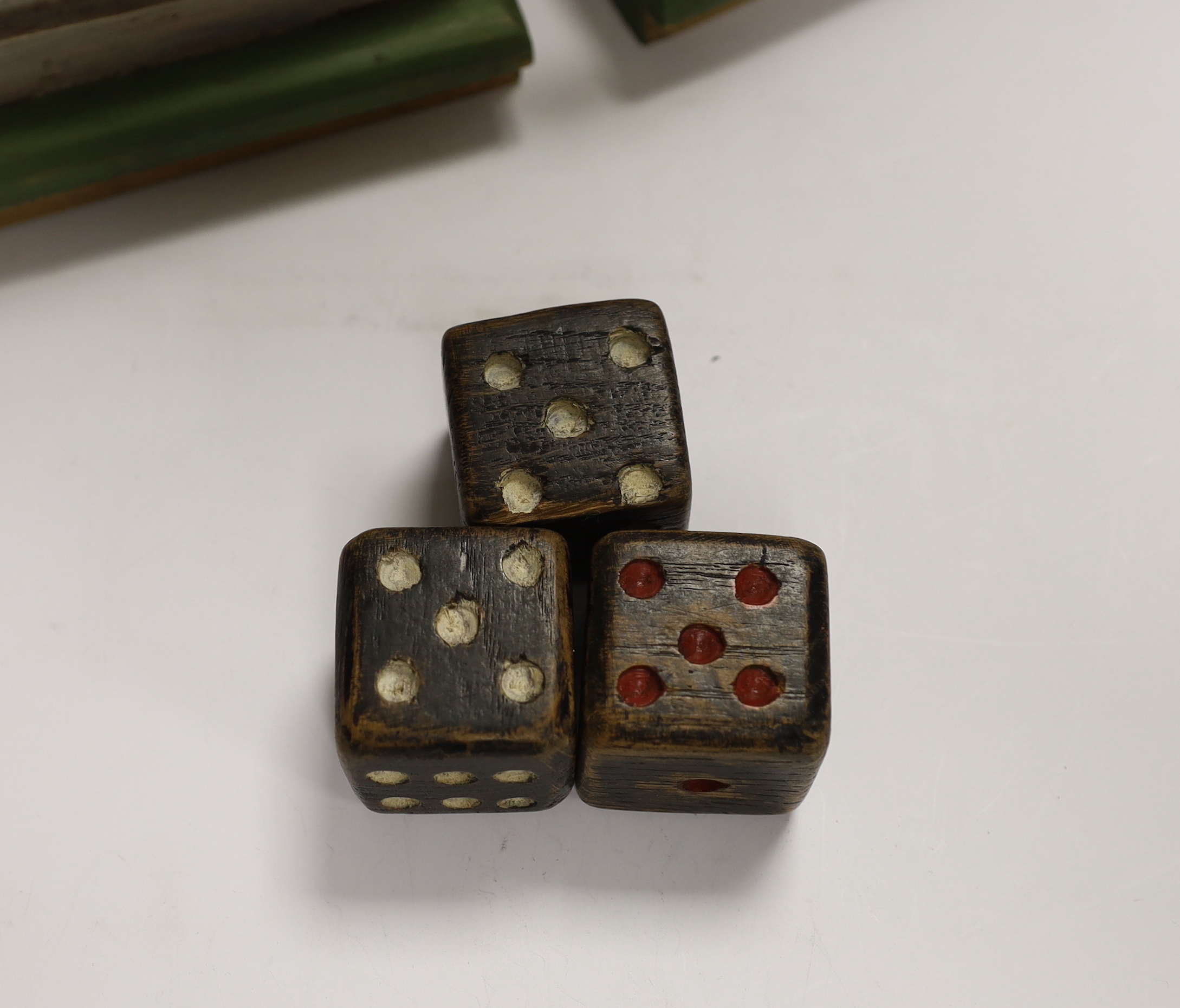 A painted wood greyhound racing game and three wooden dice, 19cm wide